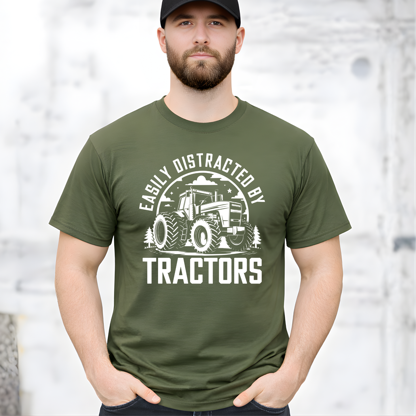 Man wearing military green Easily Distracted by Tractors t-shirt