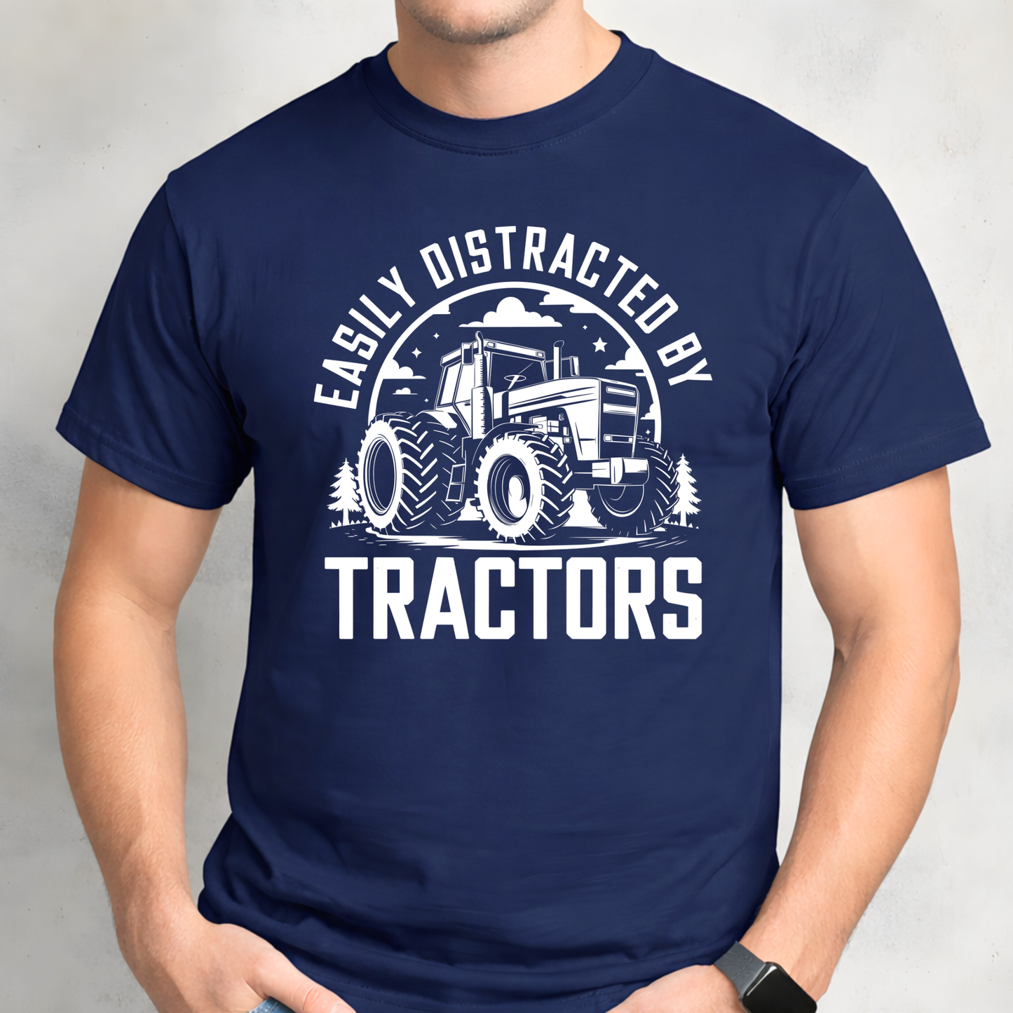 Man wearing navy Easily Distracted by Tractors t-shirt