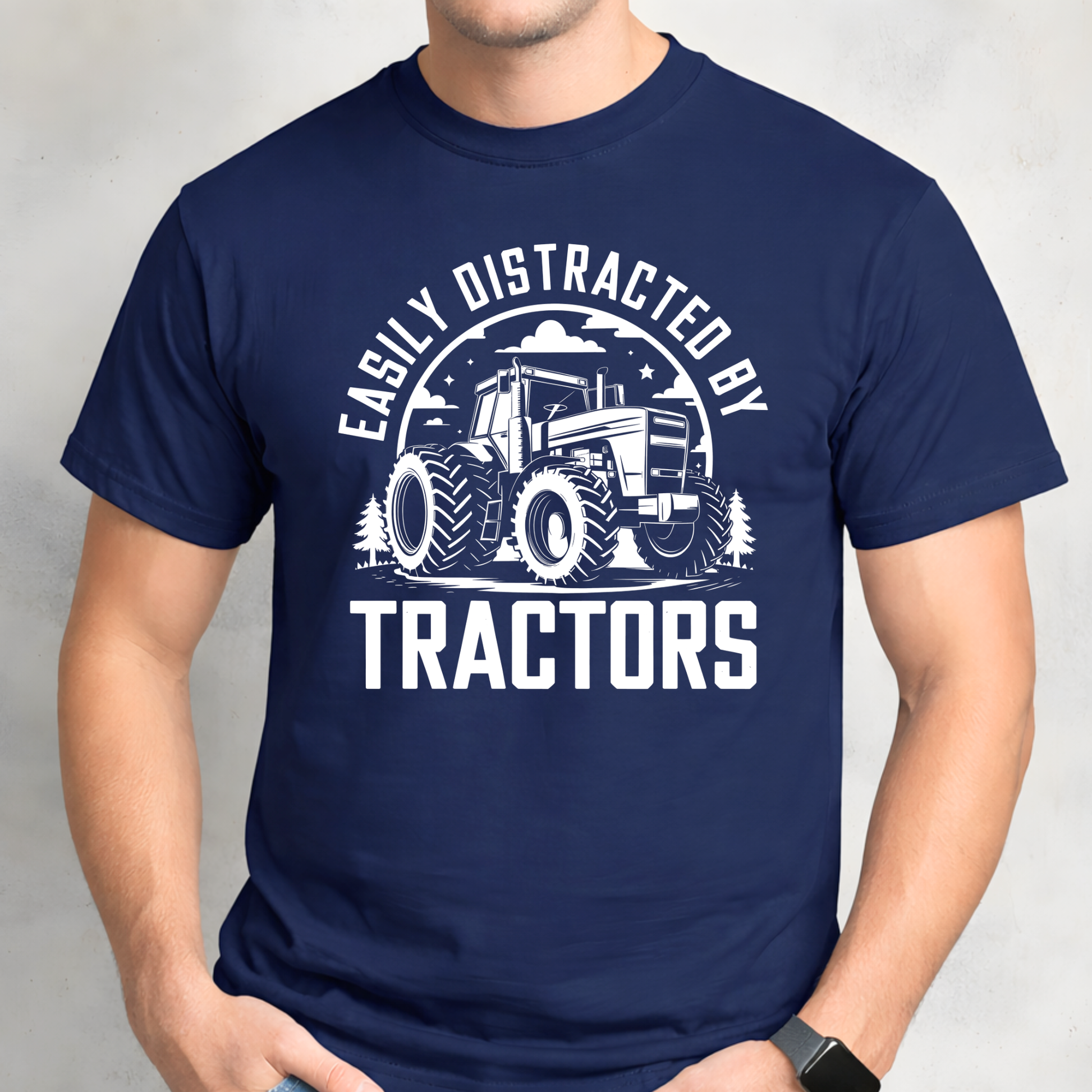 Man wearing navy Easily Distracted by Tractors t-shirt