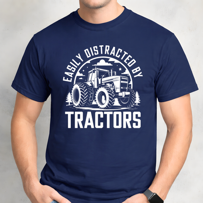 Man wearing navy Easily Distracted by Tractors t-shirt