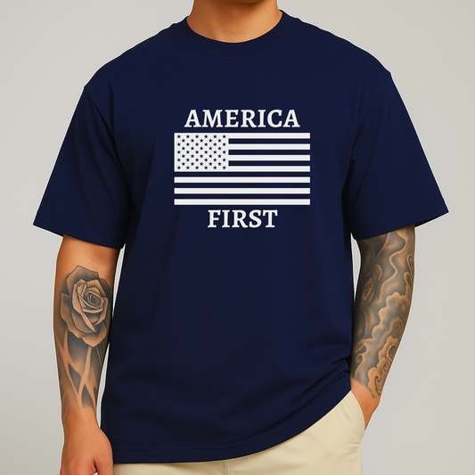 Man with arm tattoo wearing navy blue America First t-shirt with white flag print

