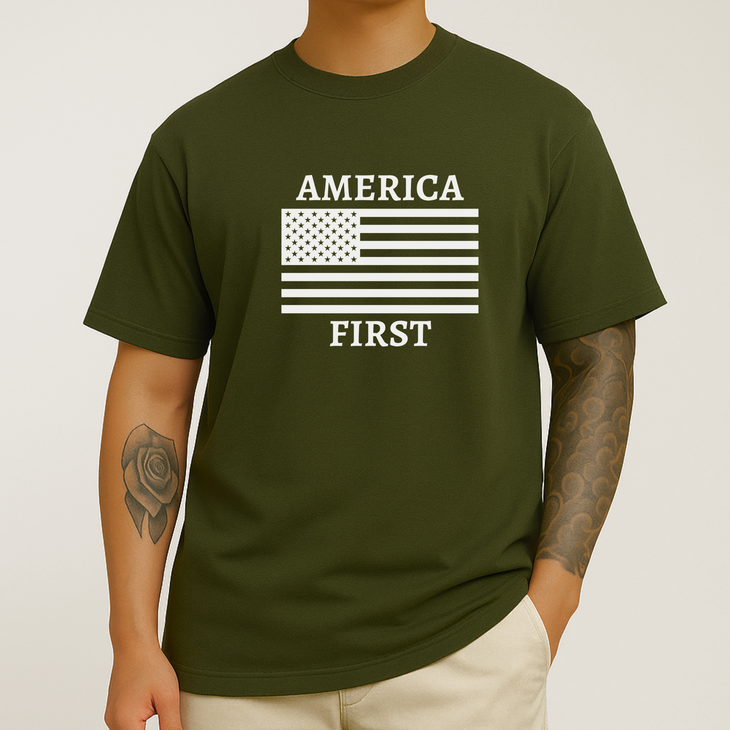 Man with rose tattoo on arm in military green America First t-shirt with white flag print