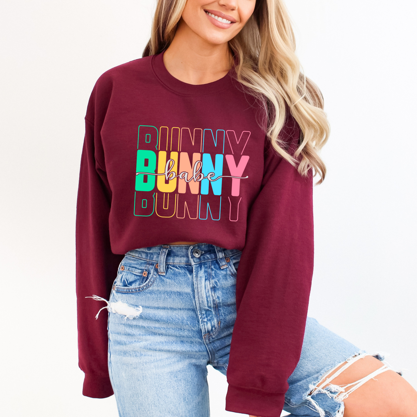 Maroon Trendy Bunny Babe sweatshirt with colorful pastel typography, perfect for Easter, spring fashion, and cozy loungewear