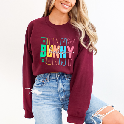 Maroon Trendy Bunny Babe sweatshirt with colorful pastel typography, perfect for Easter, spring fashion, and cozy loungewear