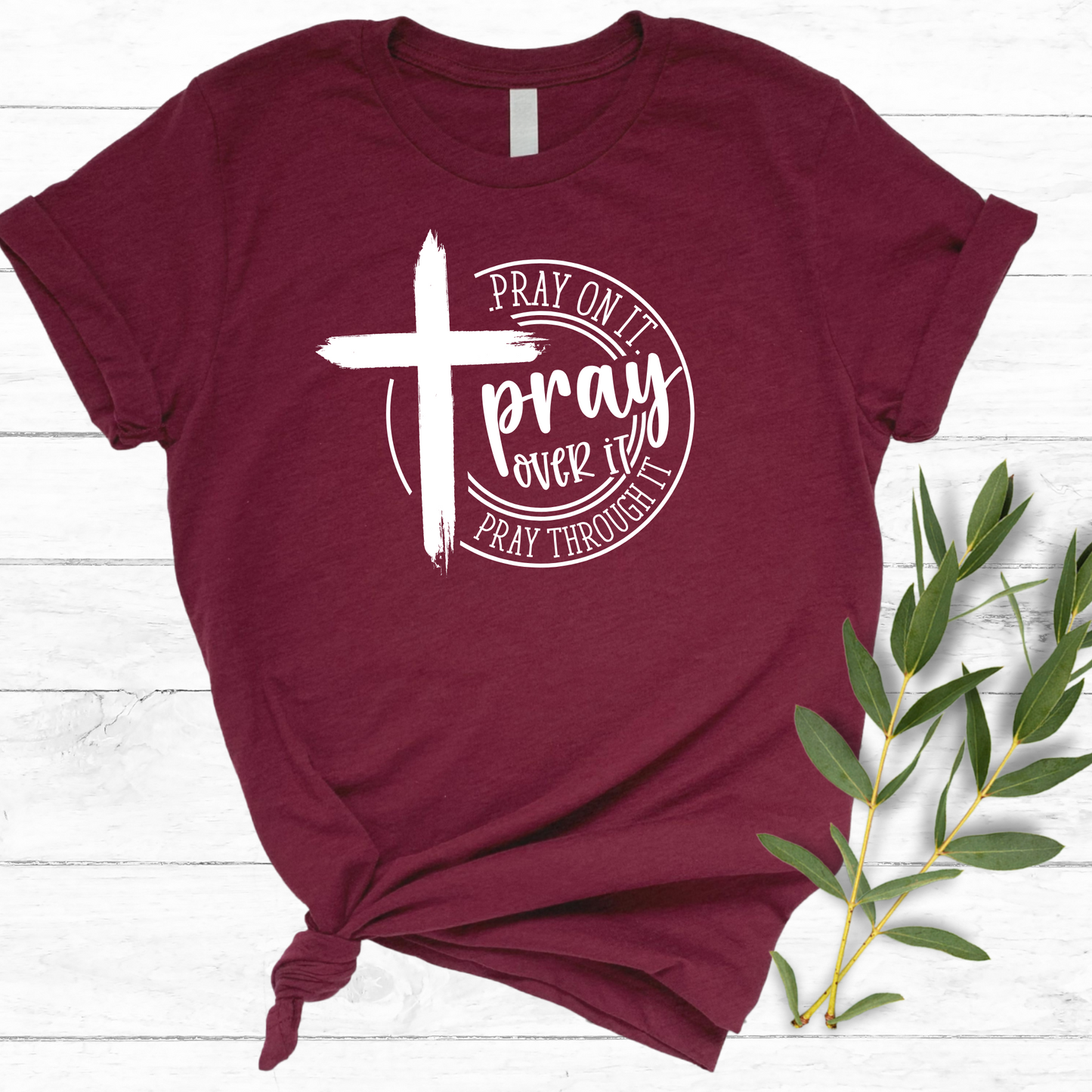 Maroon n T-shirt with black cross graphic and inspirational pray wording.