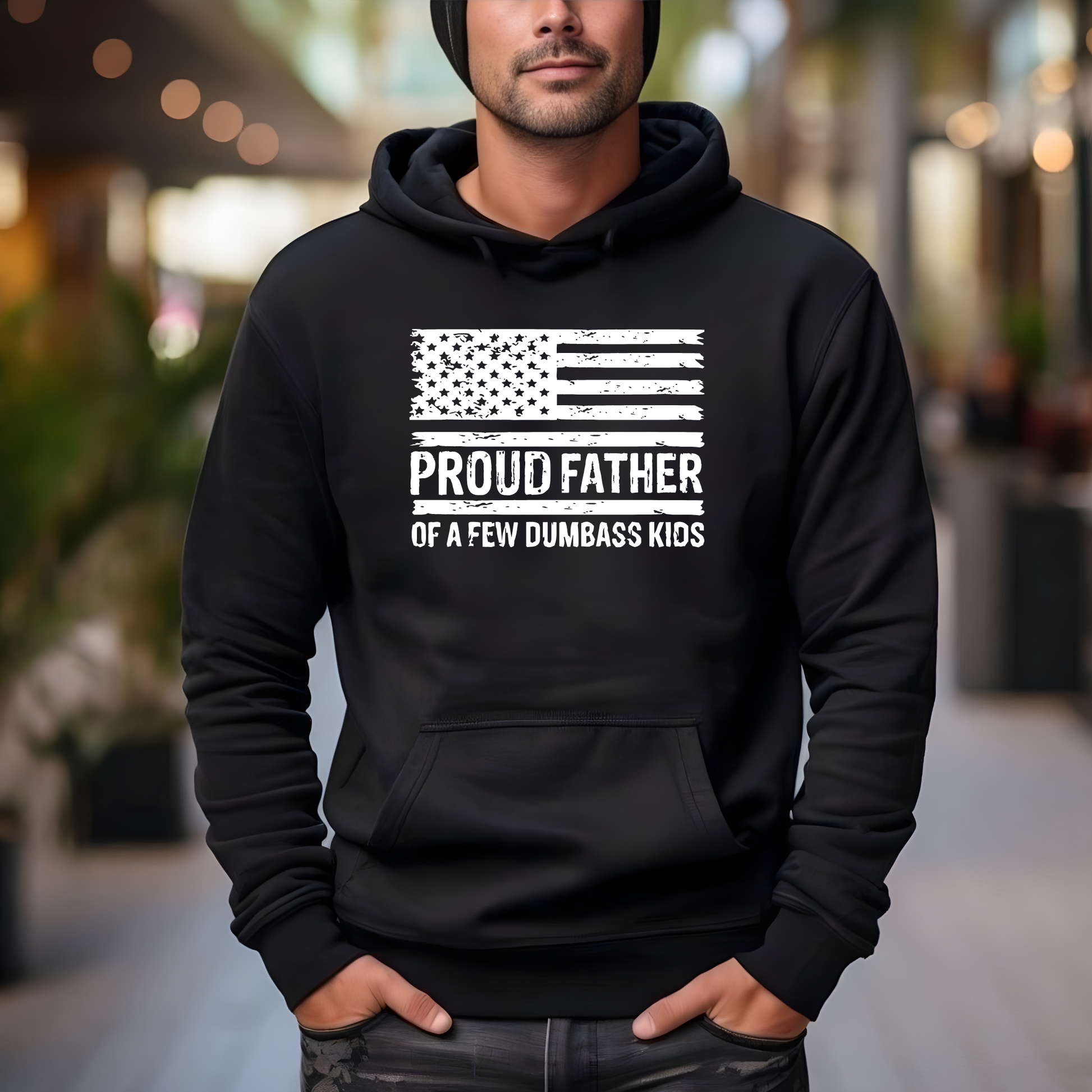 Person wearing a black hoodie with an American flag design and text.