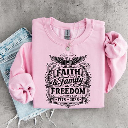 Pink sweatshirt with 'Faith & Family & Freedom' text on a concrete surface
