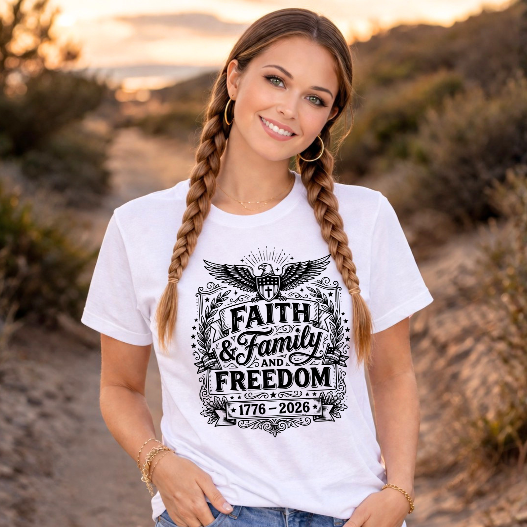 Woman wearing a white t-shirt with 'Faith, Family, Freedom' design in a desert setting