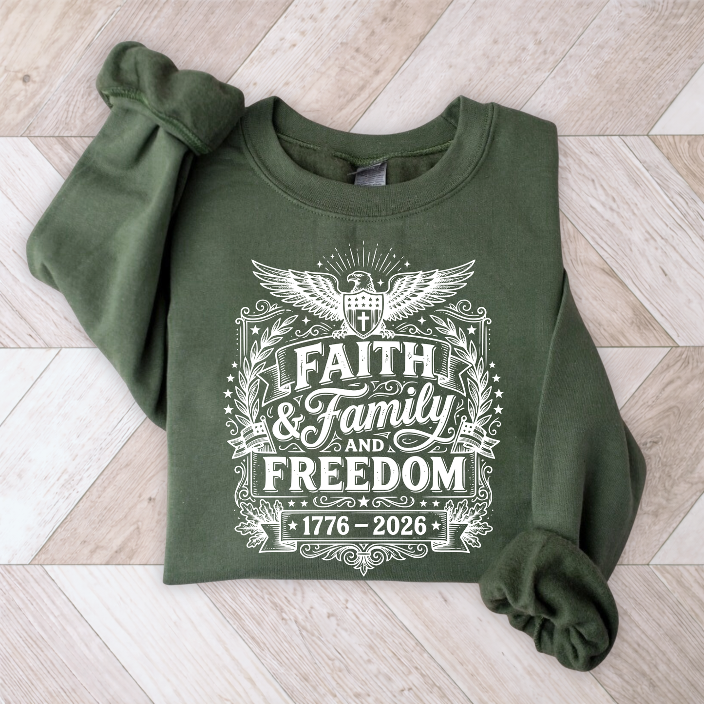 Green sweatshirt with 'Faith & Family & Freedom' text on a wooden floor