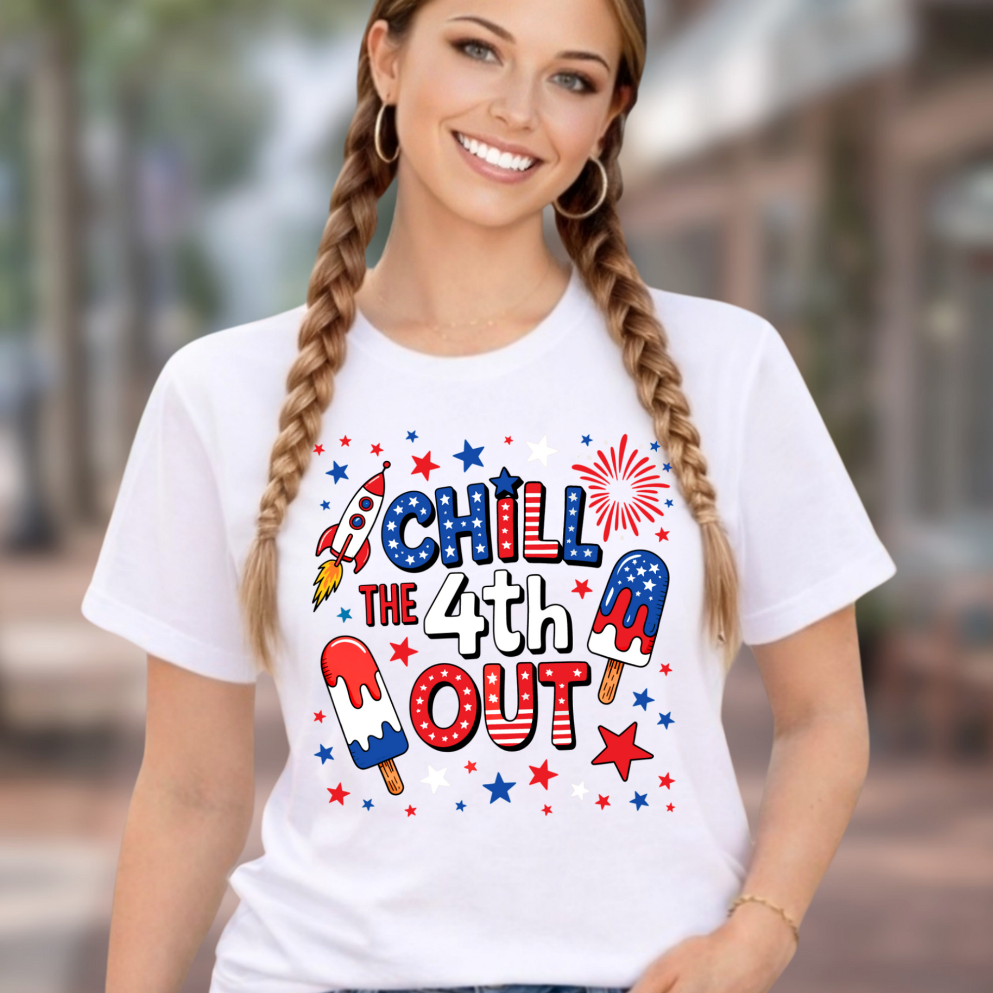 Woman wearing white patriotic chill the 4th out t-shirt with red white and blue popsicle design outdoors