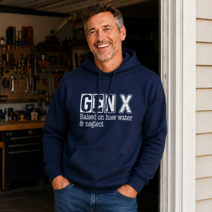 Man wearing a navy Gen X hoodie with distressed “Raised on hose water & neglect” lettering in a garage doorway.
