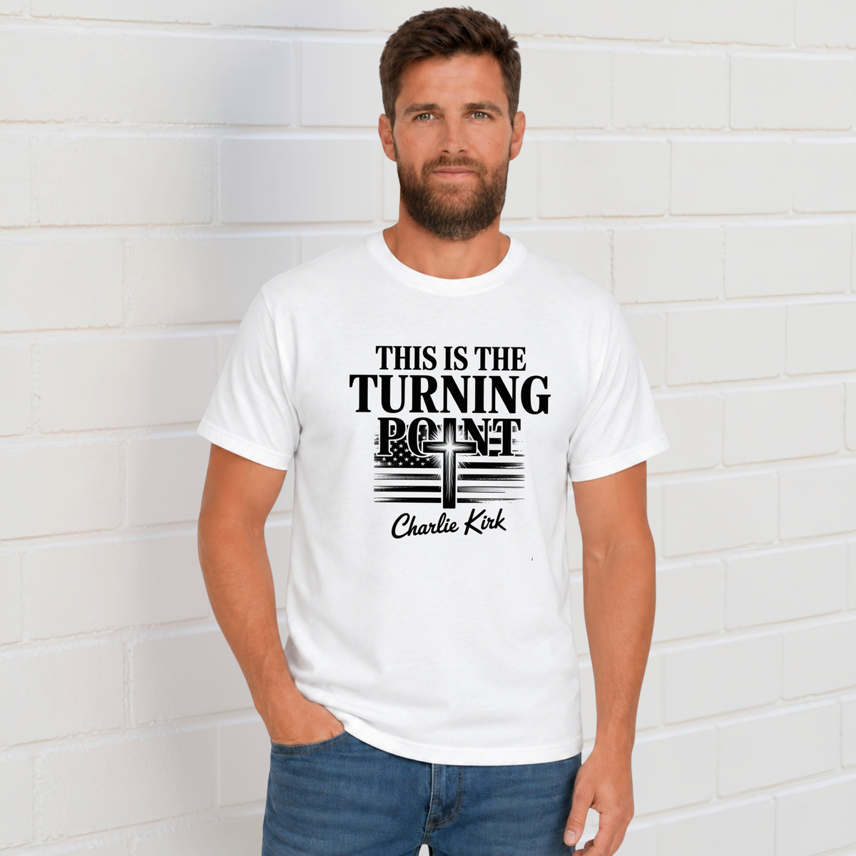 Man wearing a white T-shirt with black This Is the Turning Point cross graphic.