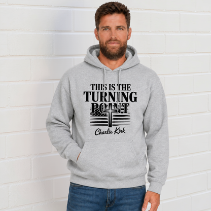 Man wearing a sports gray hoodie with black This Is the Turning Point cross graphic.