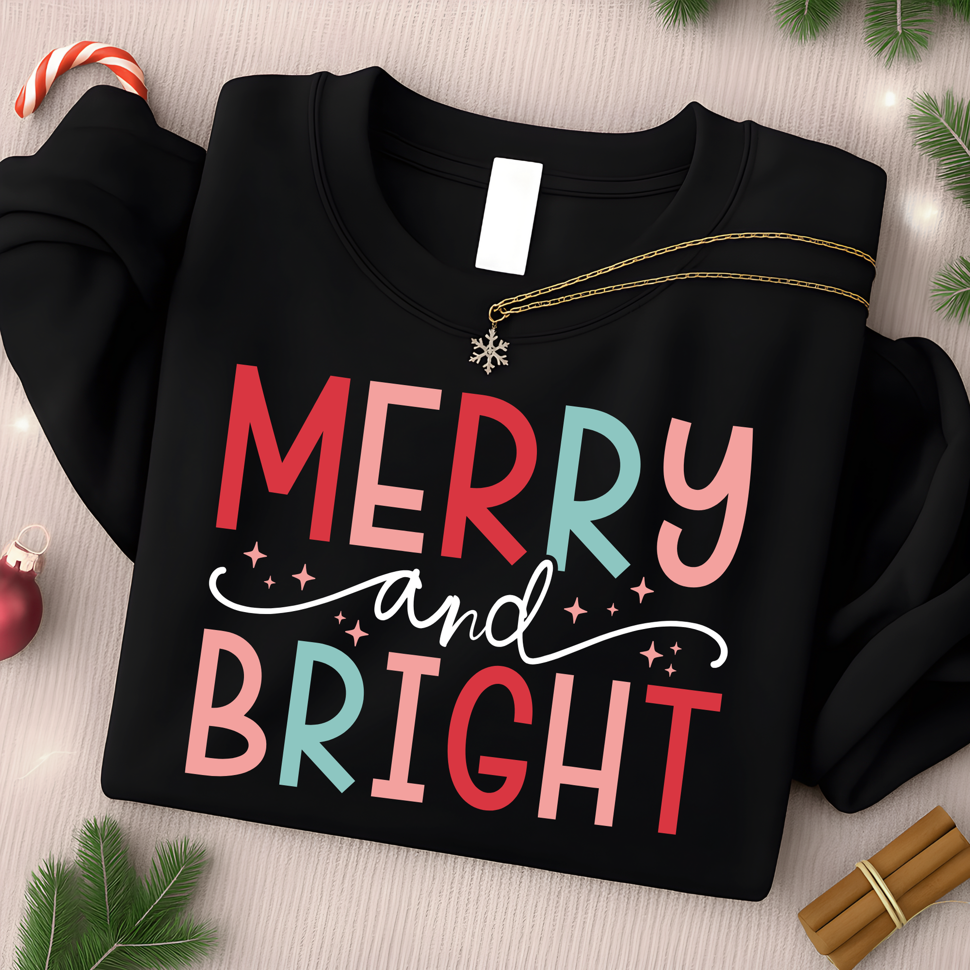 black sweatshirt flat lay with merry and bright pink and mint holiday design, unisex christmas crewneck, black friday special