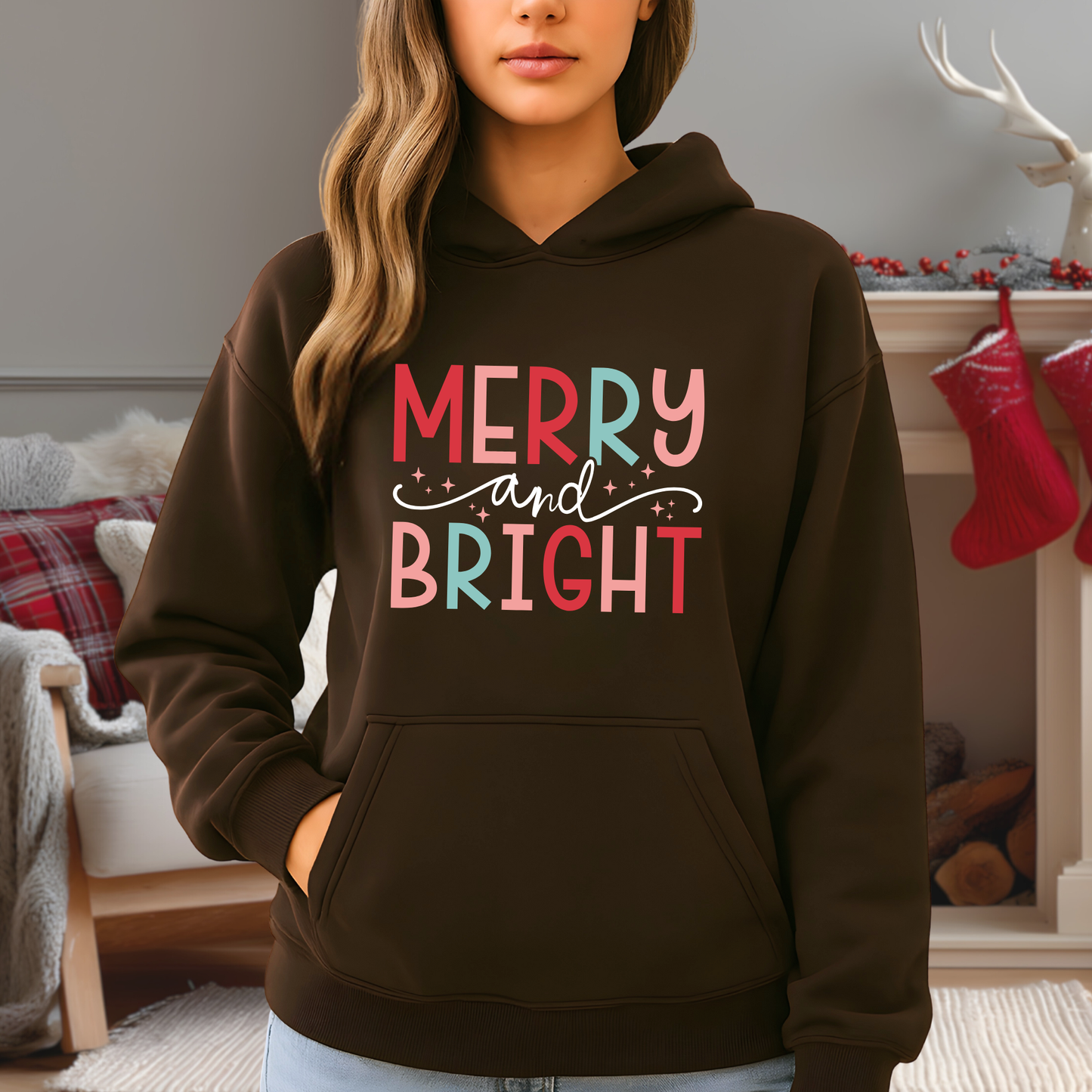 brown hoodie worn by model with merry and bright pastel christmas print, unisex holiday hoodie, black friday sale gift idea