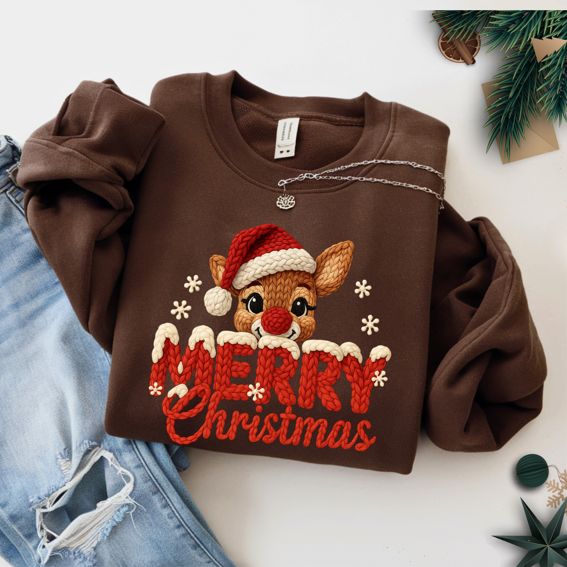 Brown sweatshirt with a reindeer design and 'Merry Christmas' text on a white background.
