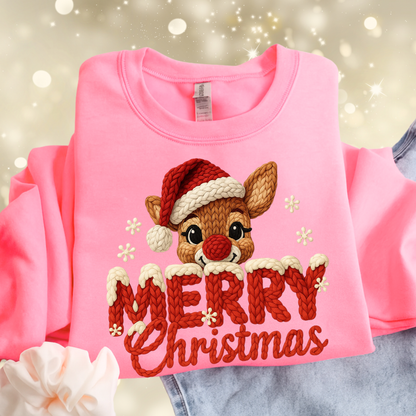 Pink sweatshirt with a reindeer design and 'Merry Christmas' text on a festive background.