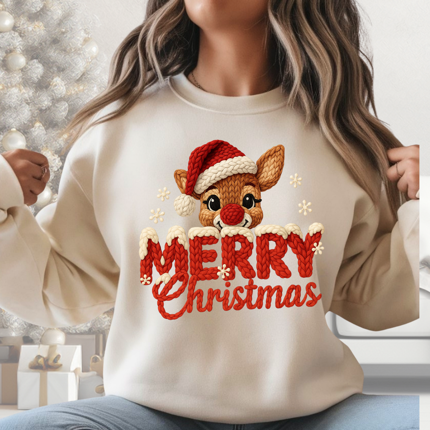 Woman wearing cream Merry Christmas reindeer chunky knit look sweatshirt in neutral holiday room