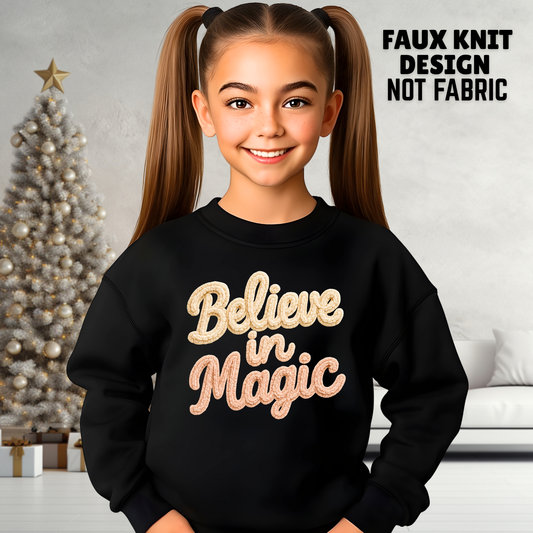 Youth girl in black faux knit Believe in Magic printed Christmas sweatshirt
