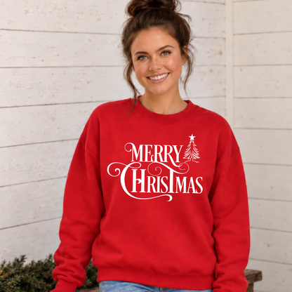 Red crewneck sweatshirt featuring the white Merry Christmas and tree graphic, worn in a rustic holiday room.