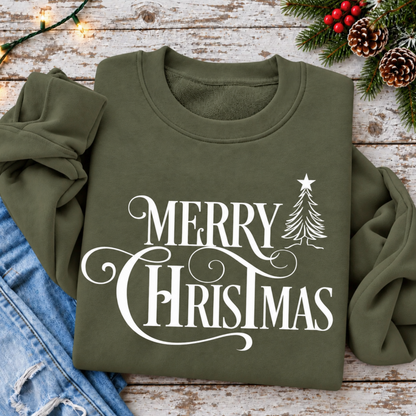Overhead flat lay of a military green Merry Christmas sweatshirt styled with jeans, pinecones, berries and string lights.