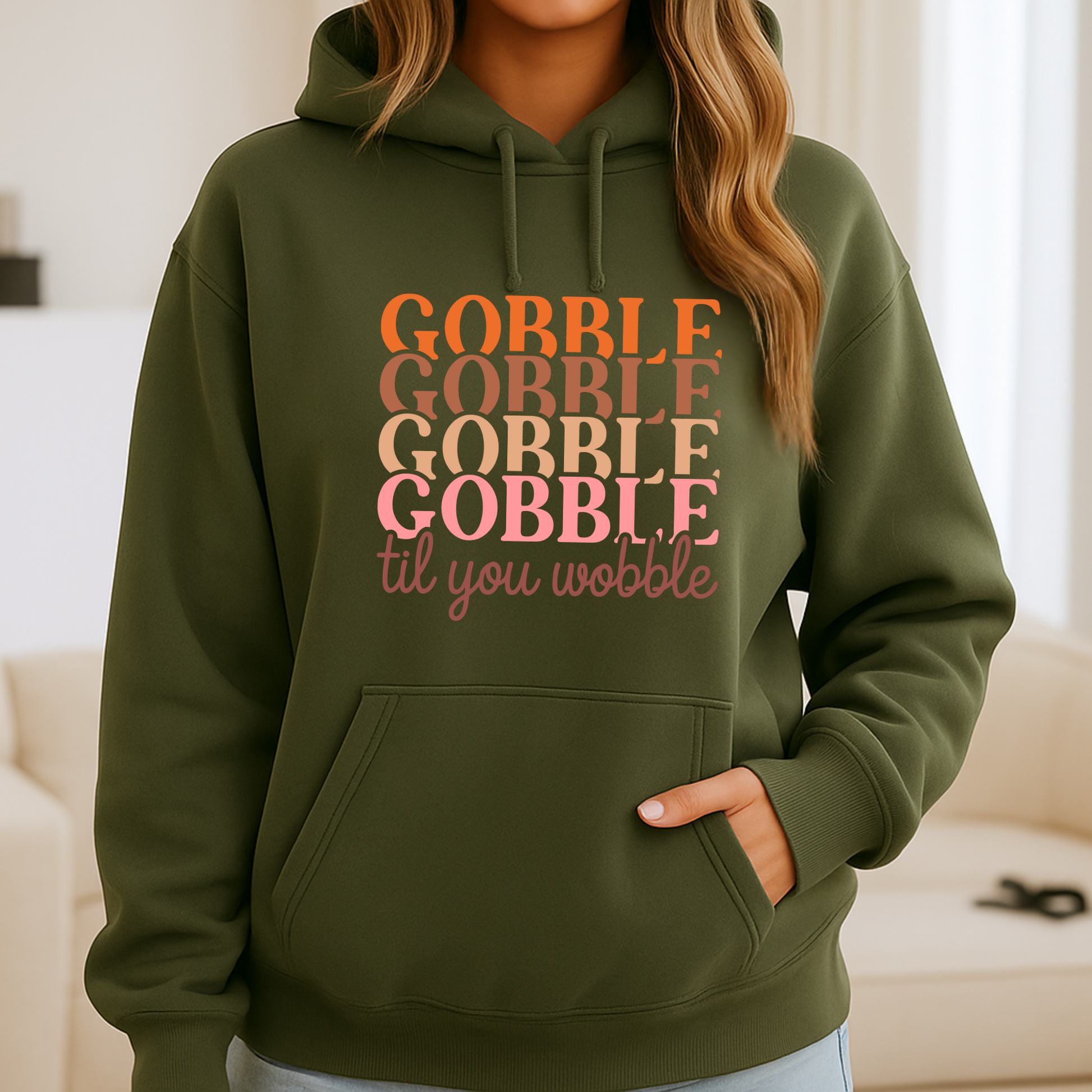 Military green hoodie styled for fall – “Gobble Til You Wobble” printed in warm colors