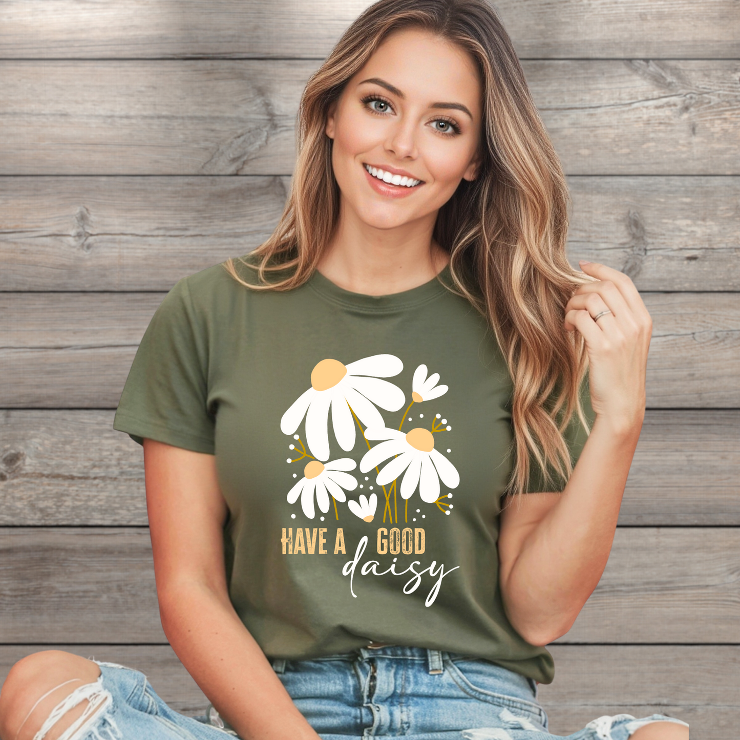 Woman wearing a green t-shirt with floral design and text against a wooden background