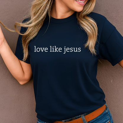 Woman wearing navy “Love Like Jesus” minimalist T-shirt smiling outdoors