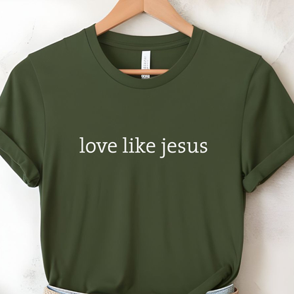 Olive green women’s T-shirt on hanger featuring “love like jesus” minimalist text design