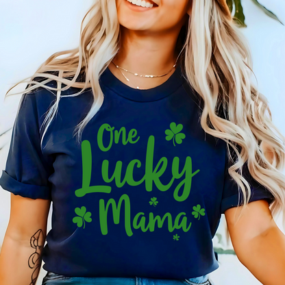 A stylish navy t-shirt with "One Lucky Mama" in green script, decorated with shamrocks. Perfect for moms celebrating St. Patrick’s Day in a cute and festive way.