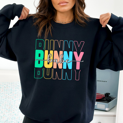 Navy Trendy Bunny Babe sweatshirt with colorful pastel typography, perfect for Easter, spring fashion, and cozy loungewear