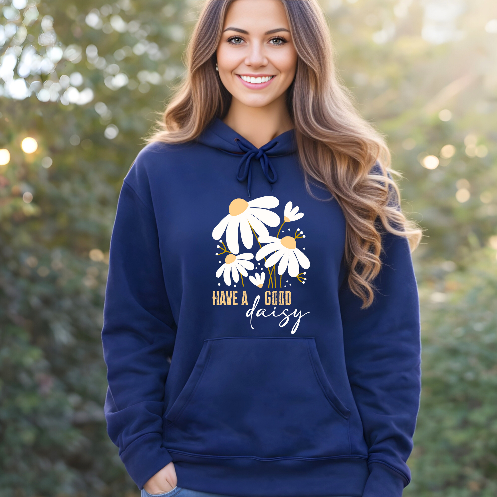 Woman wearing a navy blue hoodie with floral design and text outdoors
