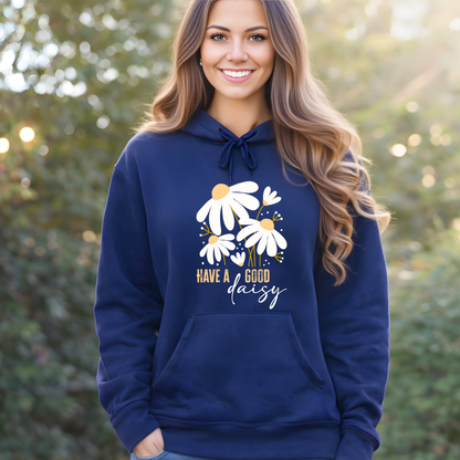 Woman wearing a navy blue hoodie with floral design and text outdoors