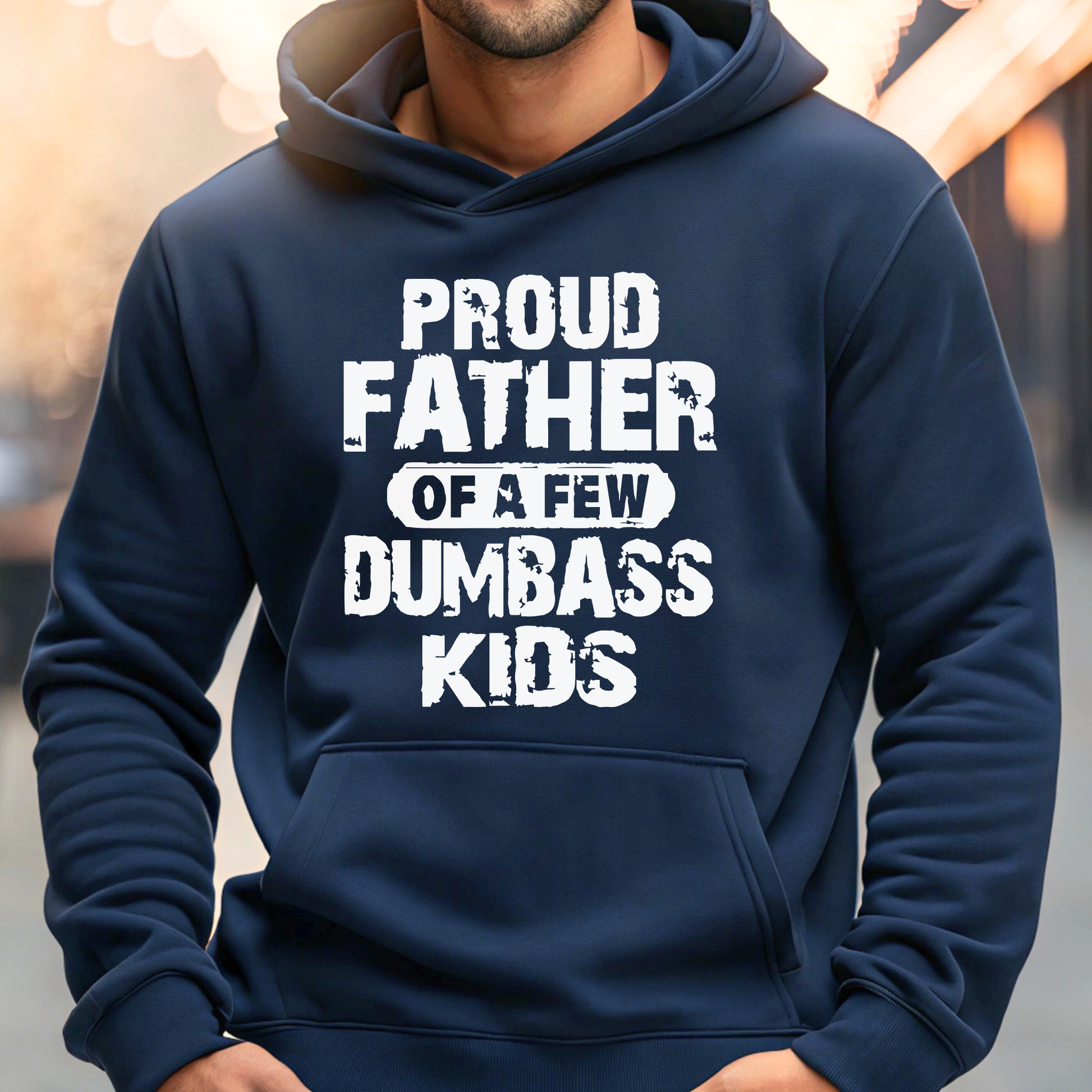 Navy blue hoodie with white text 'Proud Father of a Few Dumbass Kids' worn by a man.
