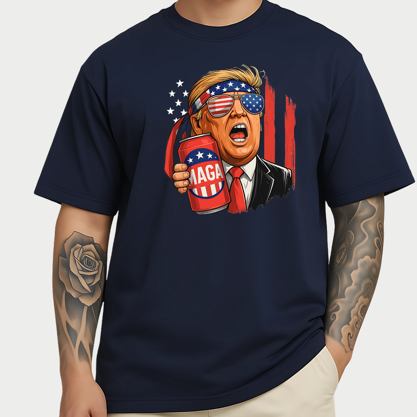 Men’s relaxed Navy Blue shirt with a bold Trump cartoon graphic, MAGA beer can, and patriotic American flag elements. A great political or freedom-themed tee.