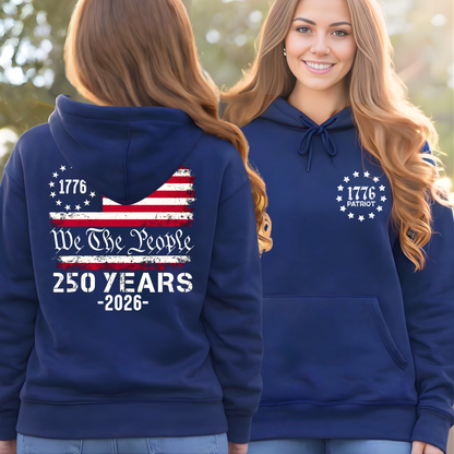Navy blue hoodie with 'We The People' and American flag design, worn by a lady outdoors.