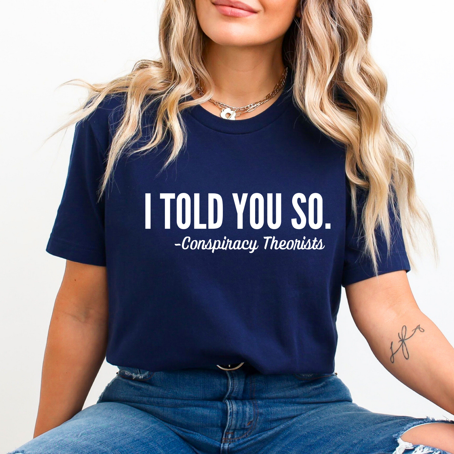 Navy blue shirt with white “I Told You So” text