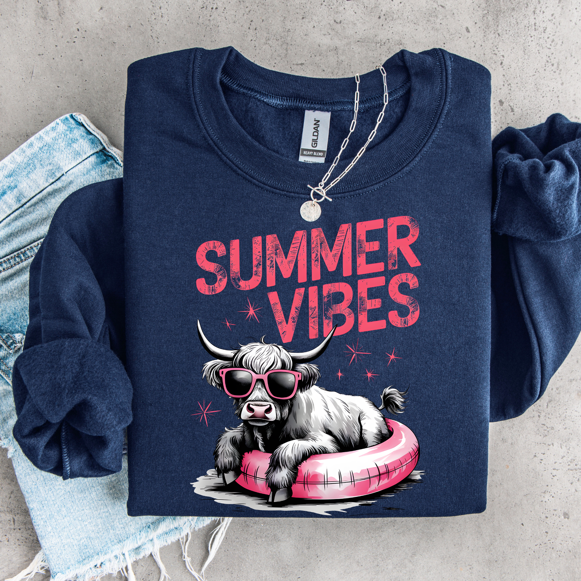Navy blue sweatshirt with 'Summer Vibes' text and cow graphic