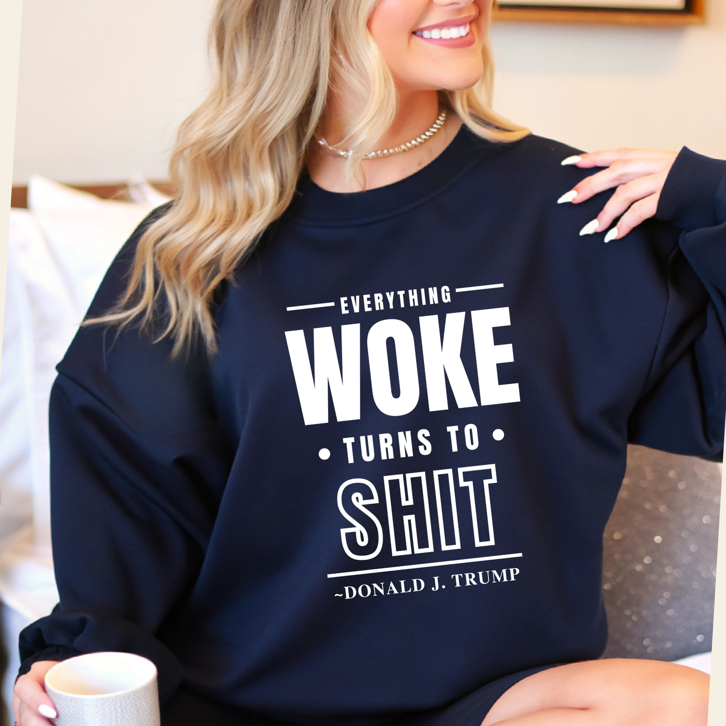 Navy blue sweatshirt with quote shown while sipping coffee