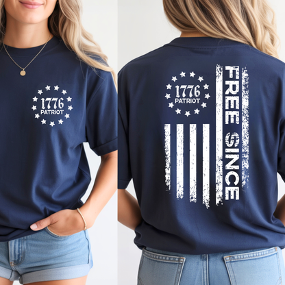 Navy blue t-shirt with '1776 Patriot' front and 'Free Since' back design on a person.