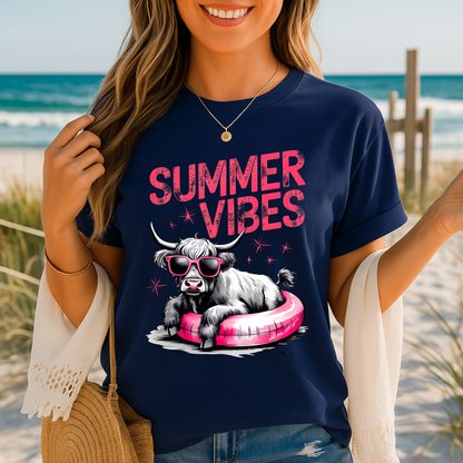 Navy t-shirt featuring Highland cow in float with sunglasses