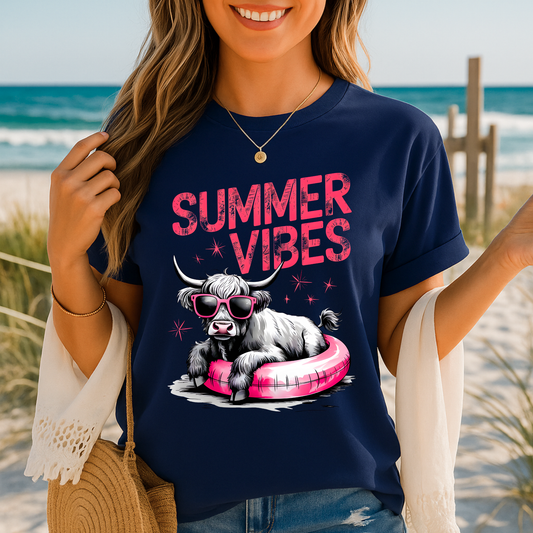 Navy t-shirt featuring Highland cow in float with sunglasses