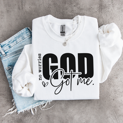 White No Worries God Got Me youth crewneck sweatshirt flat lay with bold black lettering styled with denim.