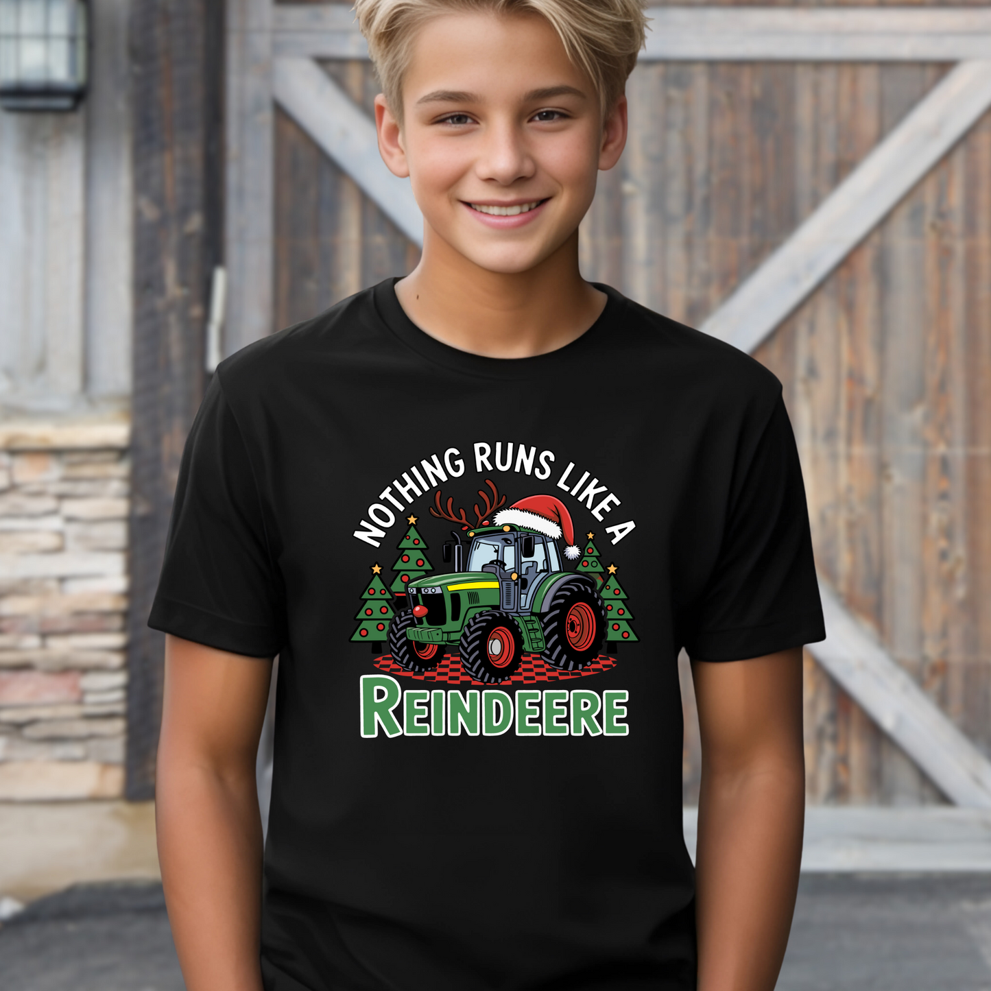Black kids Christmas tractor t-shirt with funny holiday reindeere design. Great festive shirt for boys who love tractors and farm life.