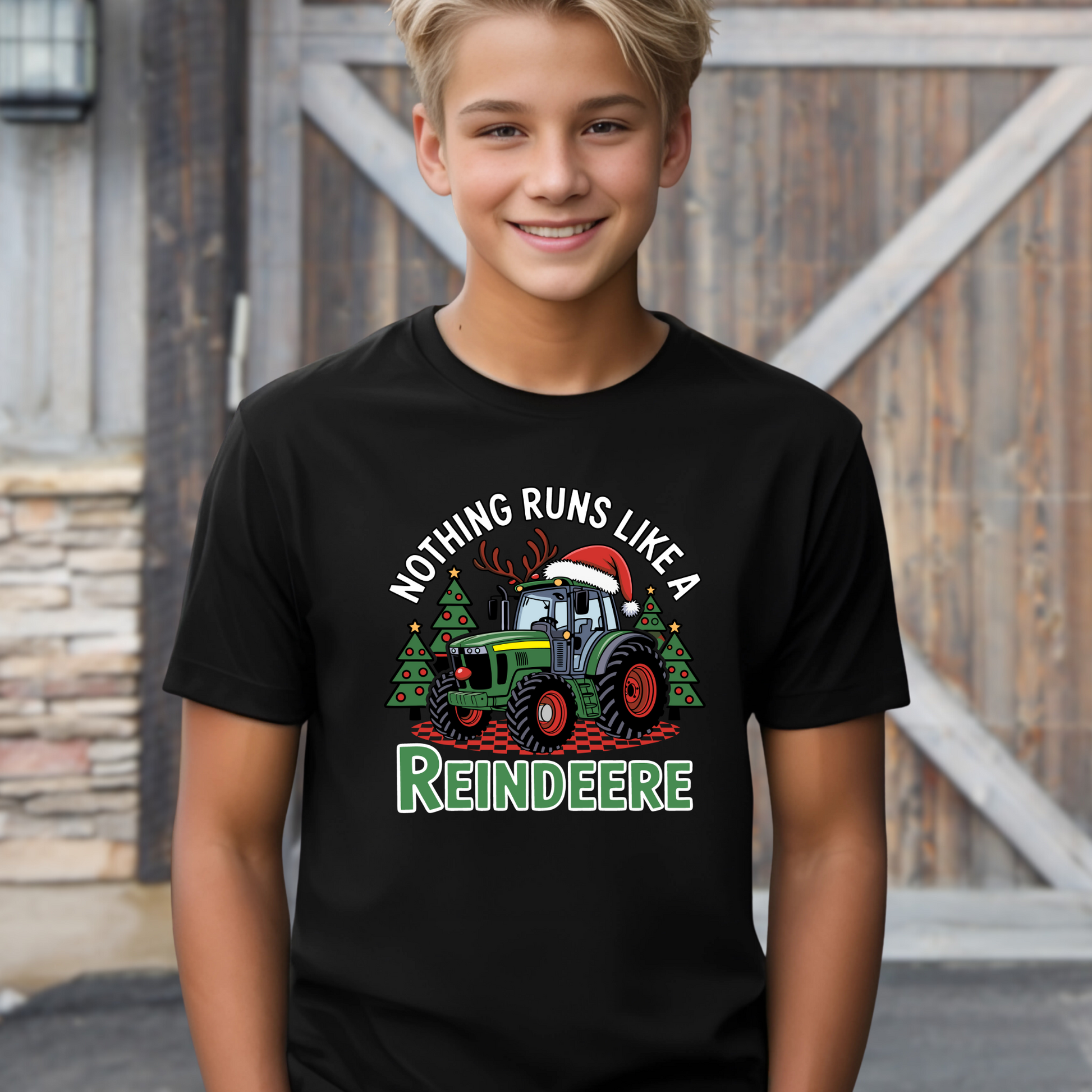 Black kids Christmas tractor t-shirt with funny holiday reindeere design. Great festive shirt for boys who love tractors and farm life.