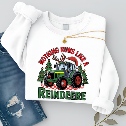 White Christmas tractor sweatshirt for women, flat lay with necklace and jeans, showcasing festive tractor holiday design. Great country Christmas pullover gift idea.