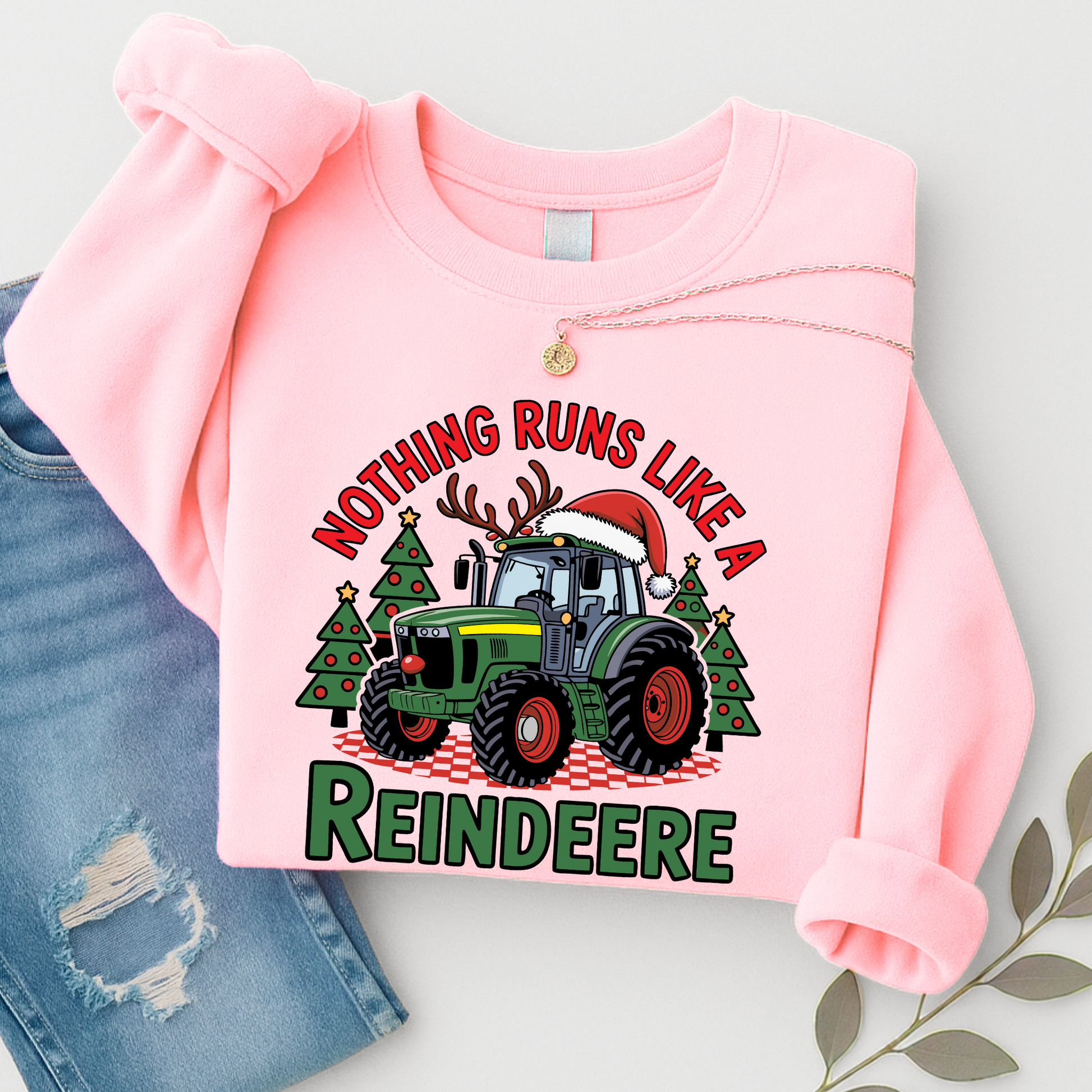 Pink women’s Christmas tractor sweatshirt with festive “Reindeere” design. Cute country holiday sweater gift for wives, moms, and daughters.