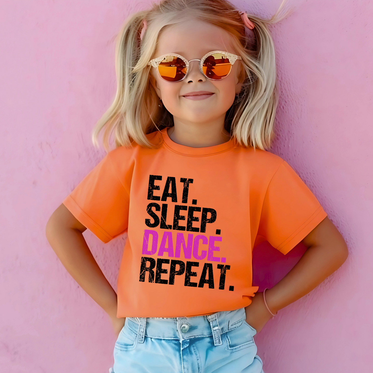 Dance all day in this trendy ‘Eat. Sleep. Dance. Repeat.’ T-shirt! Made for comfort and style, this tee is perfect for hip-hop, ballet, and jazz dancers. A must-have for any dance lover!
