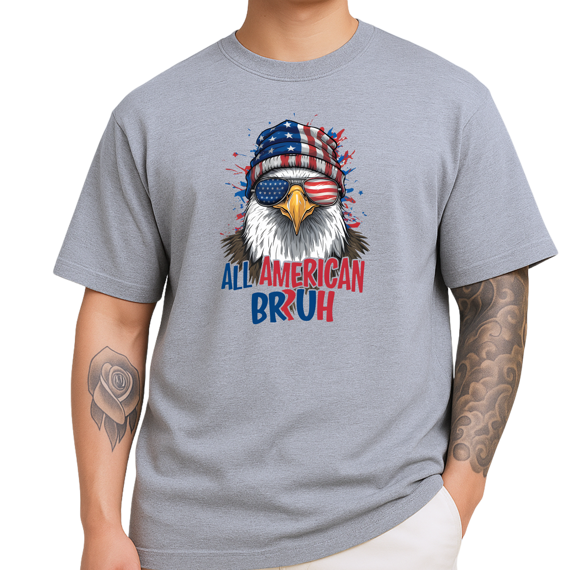 Patriotic men’s T-shirt in sports gray featuring a detailed bald eagle wearing American flag beanie and USA sunglasses. “All American Bruh” text in bold red and blue. Ideal for July 4th BBQs, military events, or as a funny gift for patriotic guys.

