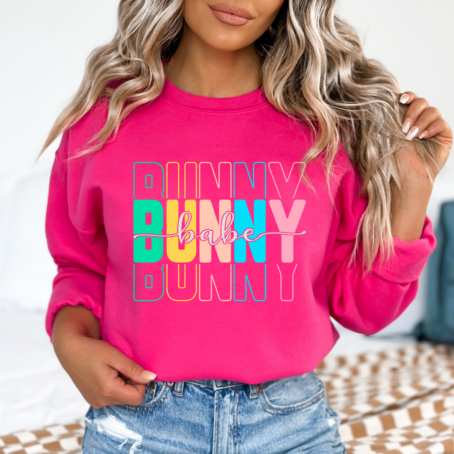 Pink Trendy Bunny Babe sweatshirt with colorful pastel typography, perfect for Easter, spring fashion, and cozy loungewear
